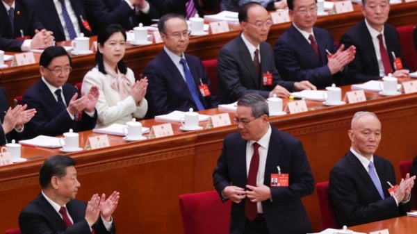 中共党魁习近平（左）与中央政治局常委、中央书记处书记蔡奇蔡奇（右）参加中共两会。（图片来源：Getty Images）