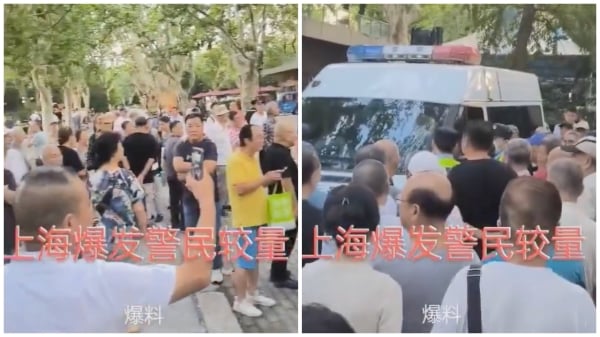 逾百民眾包圍警車，拉下被警車帶走的演講者。（視頻截圖）