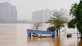 广州暴雨一河段决堤50米传至少2人触电身亡(图)