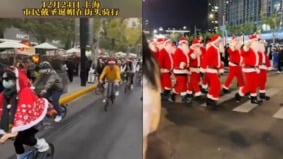 上海警局一堆圣诞老人传女子被抓引发戴圣诞帽“骑行潮”(图)