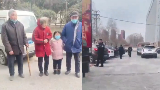 河南村镇银行受害者全家人跨省到郑州讨说法，有几名黑衣男子在一旁监视。